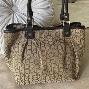 Calvin Klein monogrammed brown cloth handbag